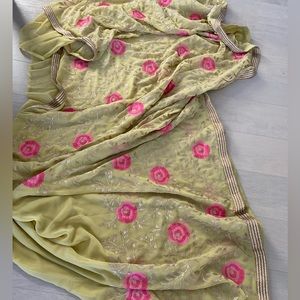 Pastel light color saree with colorful pink flower and goldish leaf embroidery